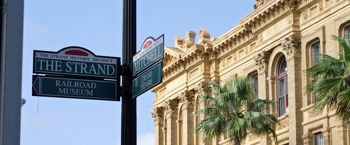 The Strand corner sign post in the historic downtown district of Galveston Island, Texas