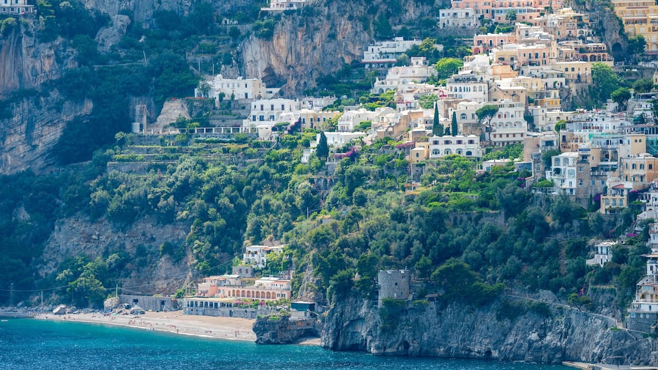 Positano city seen from afar. The Fornillo beach with the ancient Saracen tower. Amalfi Coast ITALY