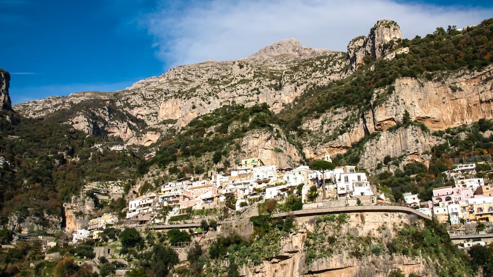 Panoramic view from coastal town Positano on mountain peaks of Monte San Michele, Molare, Canino, Caldare in Lattari Mountains, Apennines, Amalfi Coast, Italy, Europe. Parts of upper Positano village