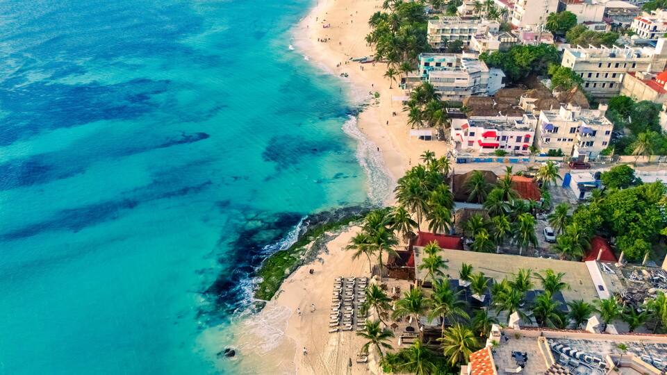 Aerial view of Playa del Carmen, Mexico, with turquoise waters and reefs