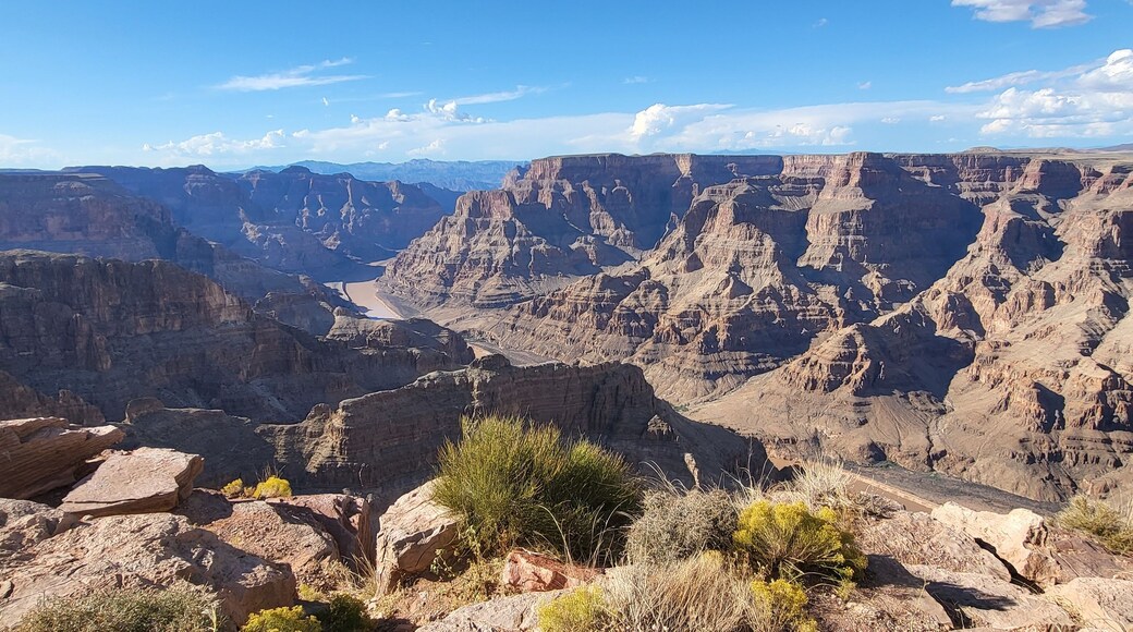 A canyon with a road cutting through it.