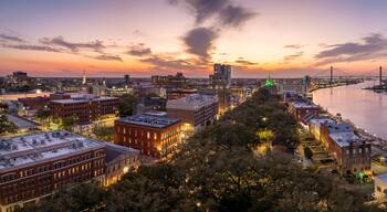 Savannah, Georgia. Old historic River Street architecture. View from above of illuminated streets at night. USA tourist attraction