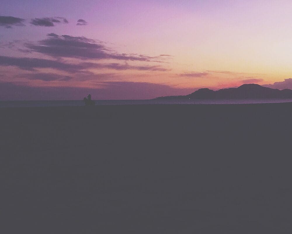 #Colorful sunsets are made even better as a lone Mexican cowboy rides his horse along the coastline. #goldenhour