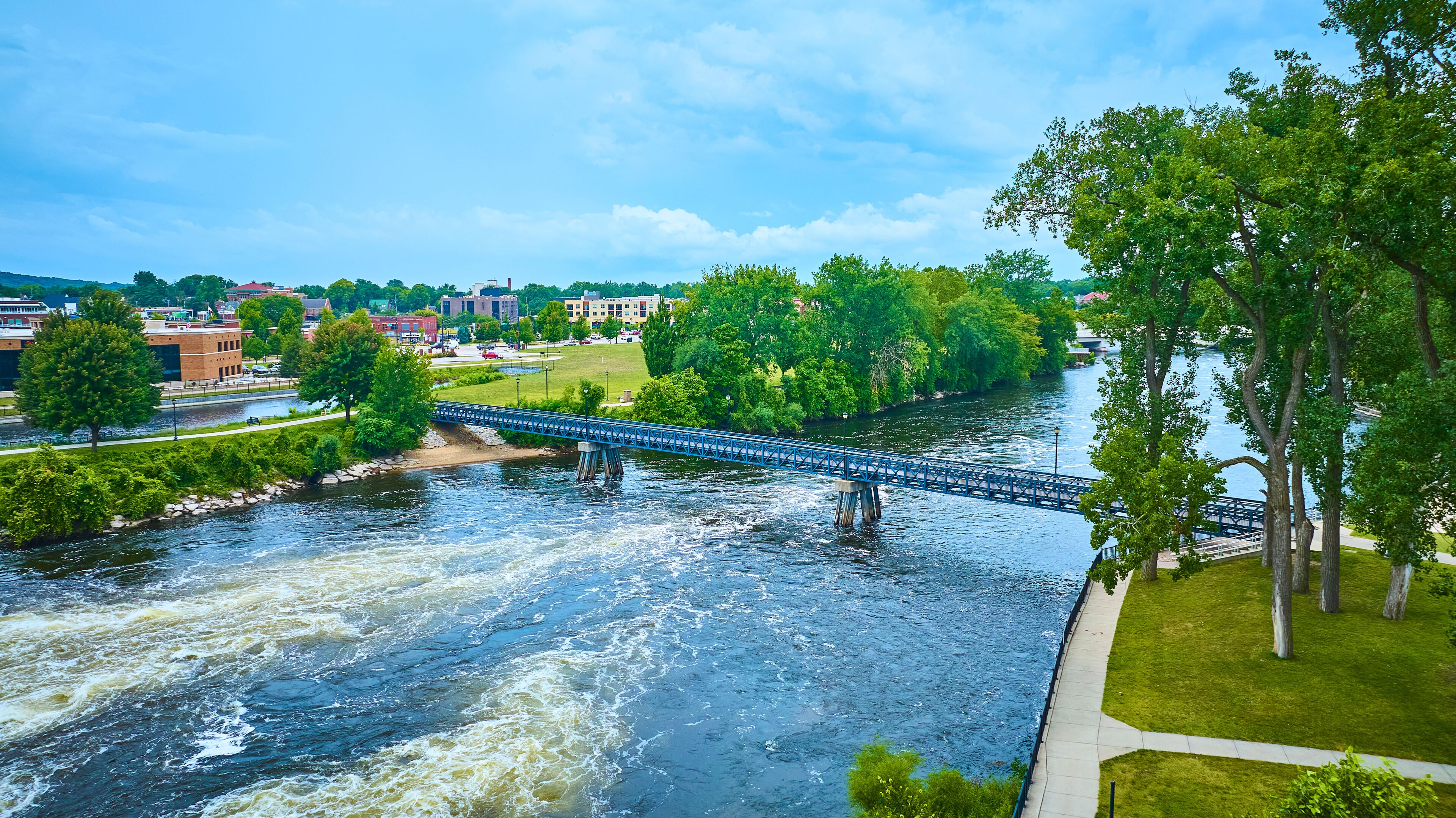 Aerial of Blue Pedestrian Bridge over St. Joseph River in Mishawaka