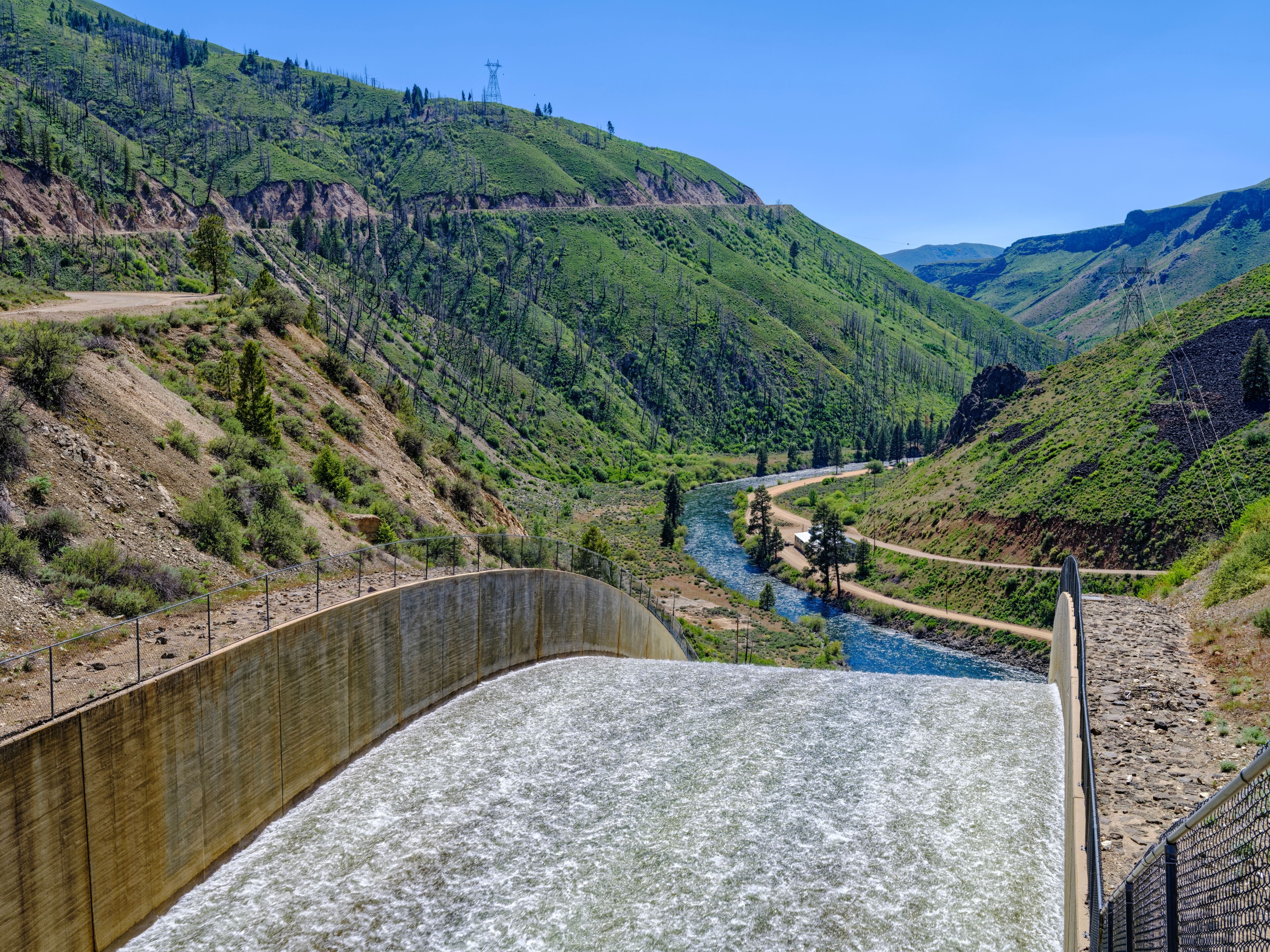 Water surges through the top of the spillway at the Anderson Ranch Dam near Mountain Home, Idaho, USA