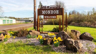 Monroe Welcome sign on the highway