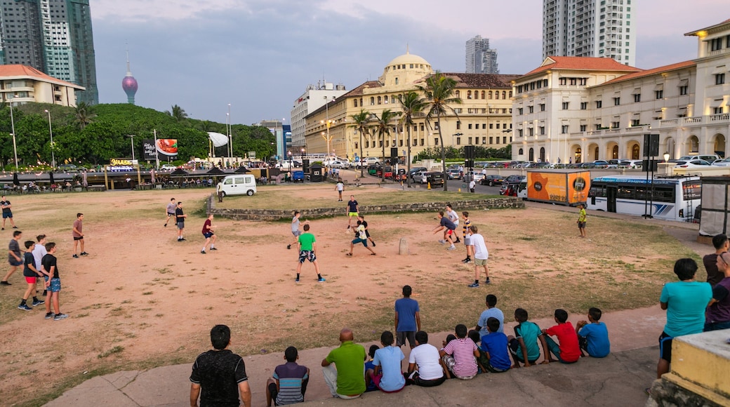Colombo which includes a coastal town and a sporting event as well as a large group of people