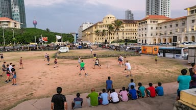 Colombo which includes a coastal town and a sporting event as well as a large group of people