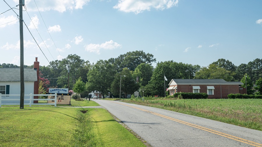 Carrollton featuring farmland and a small town or village