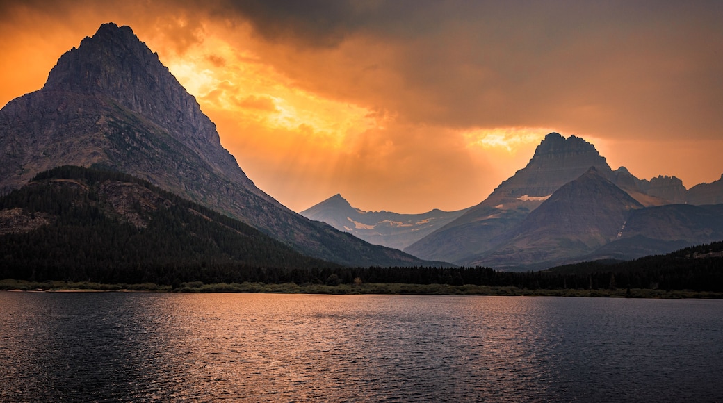 Swiftcurrent Lake and Mountain Fire Sky Sunset at Many Glacier, Glacier National Park, Montana