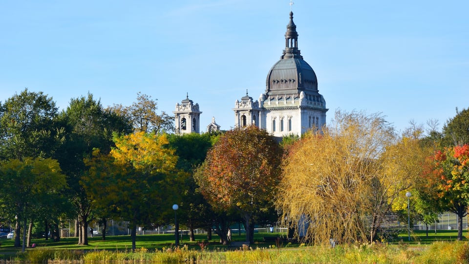 Small park in Downtown Minneapolis with colorful trees and reflection during Autumn