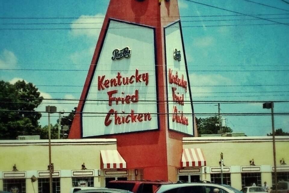 A Kentucky Fried Chicken restaurant with a prominent red and white sign.