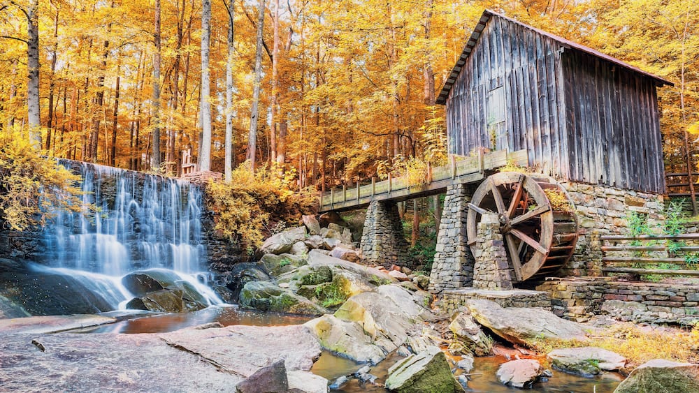 Fall or Autumn image of historic mill and waterfall in Marietta, GA