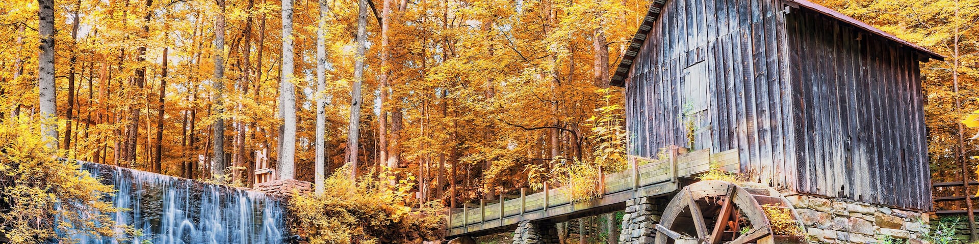 Fall or Autumn image of historic mill and waterfall in Marietta, GA