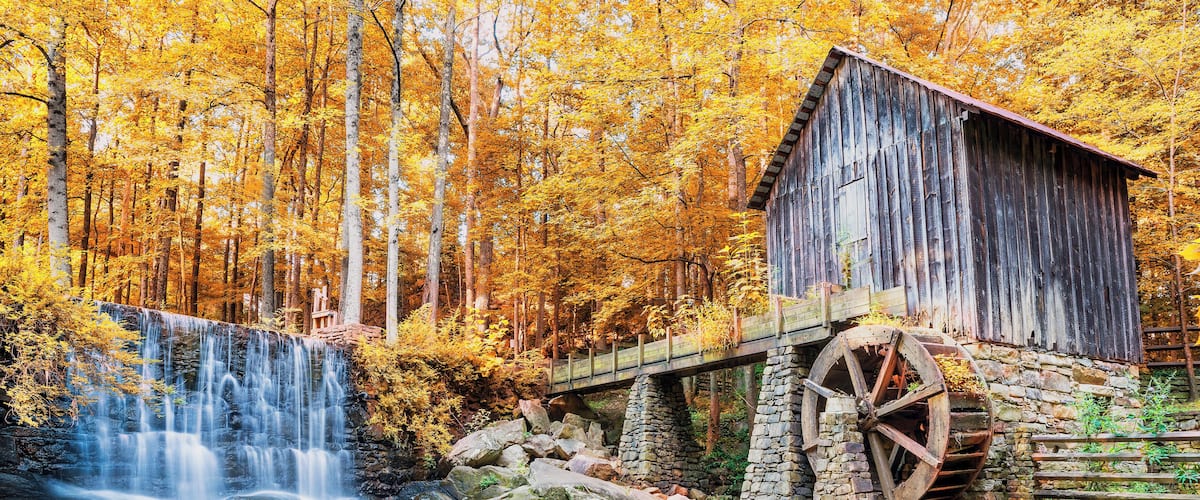 Fall or Autumn image of historic mill and waterfall in Marietta, GA