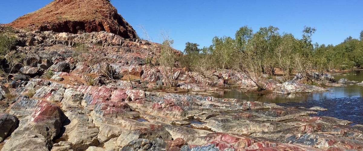 The Marble Bar is a spectacular 'bar' of #blue and red Jasper, which spans the Coonan River. Located just 5 kilometres from the town centre, the clear pool below makes Marble Bar a popular swimming spot. The 'Marble Bar' derived its name from pioneers who mistook the bar for 'marble'.