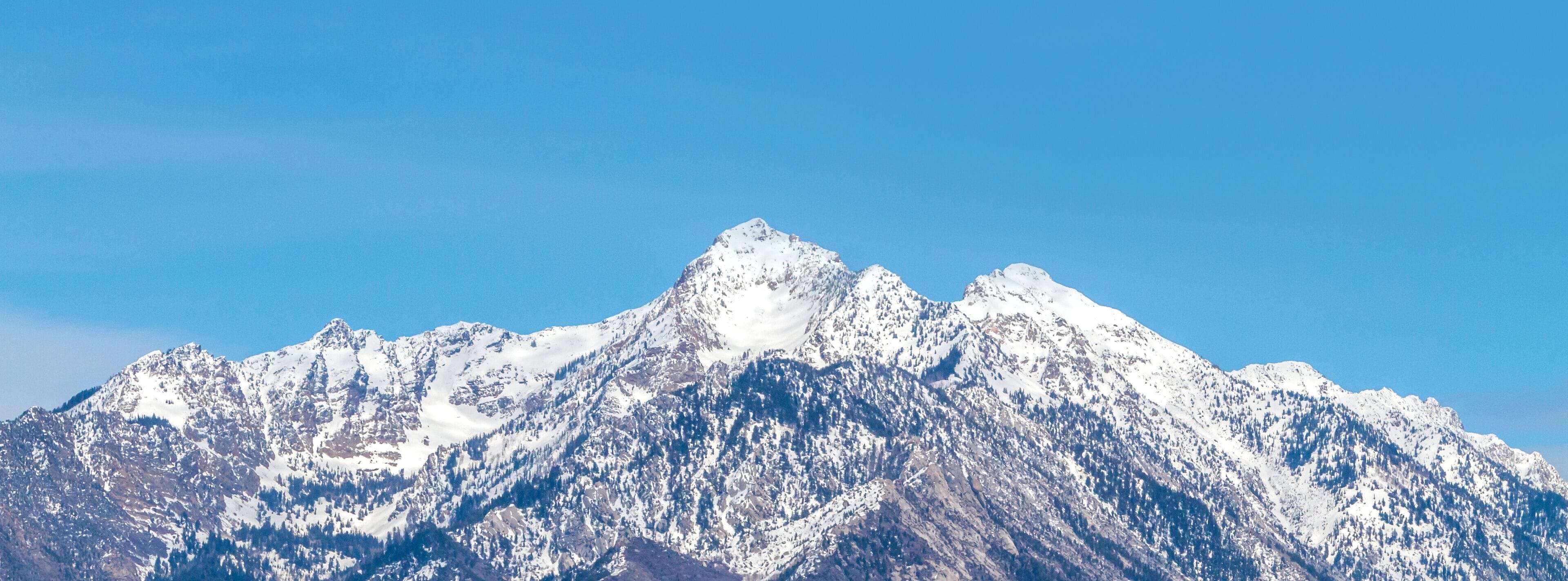 The Wasatch (Uinta) mountain range located along the east side of the Salt Lake valley (Utah). This peak is called Twin Peaks.