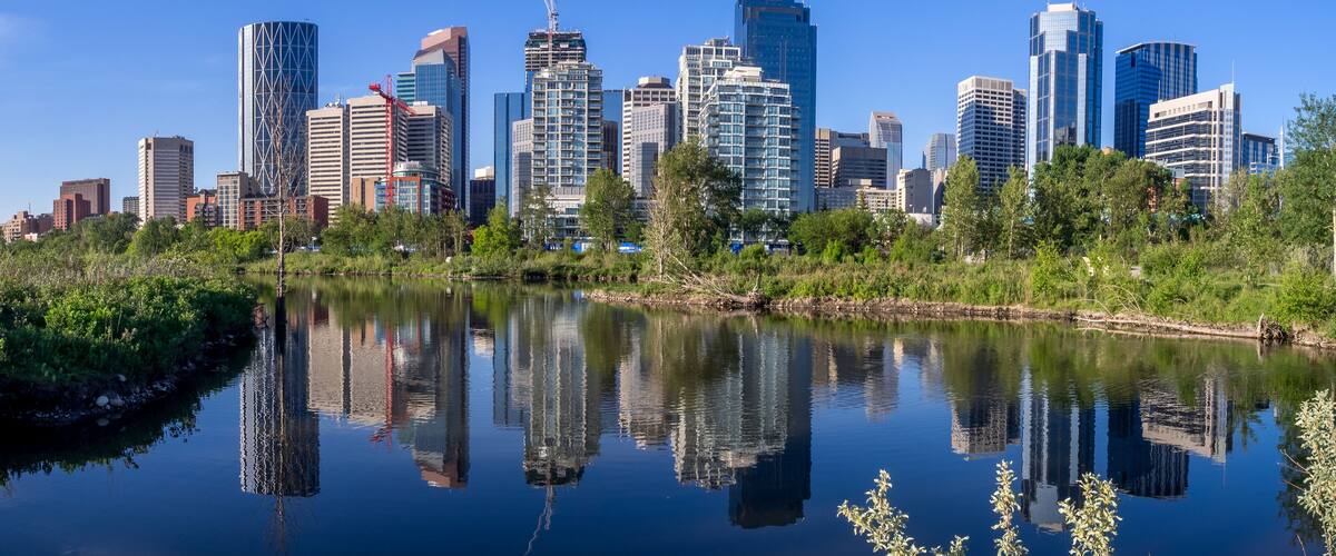 Calgary skyline reflected in a reconstructed urban wetland along the Bow River.