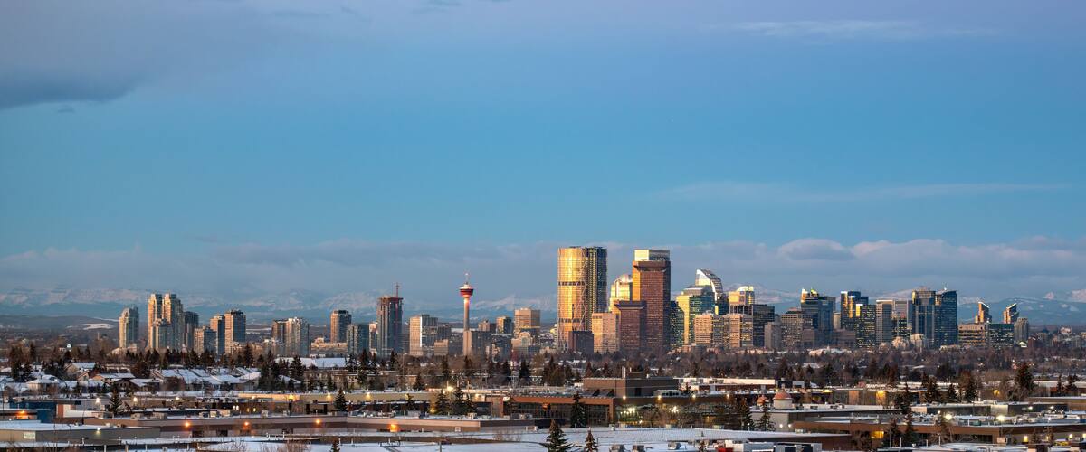 Calgary, Alberta, Canada city skyline with the mountains in the background.