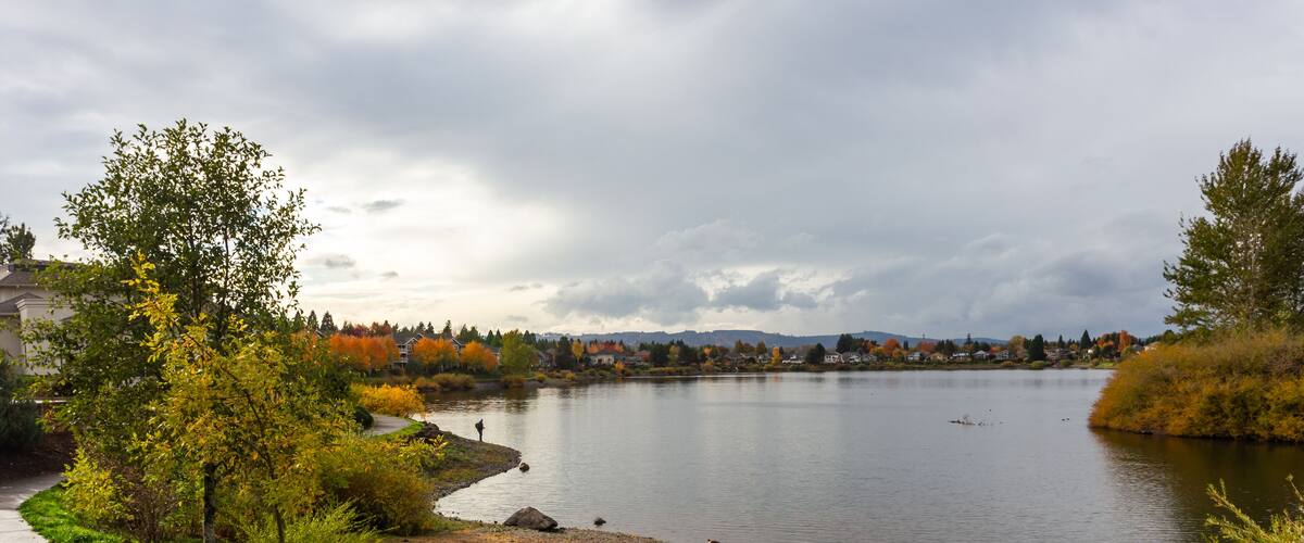 Lonely figure of a fisherman on the private Staats lake in Oregon