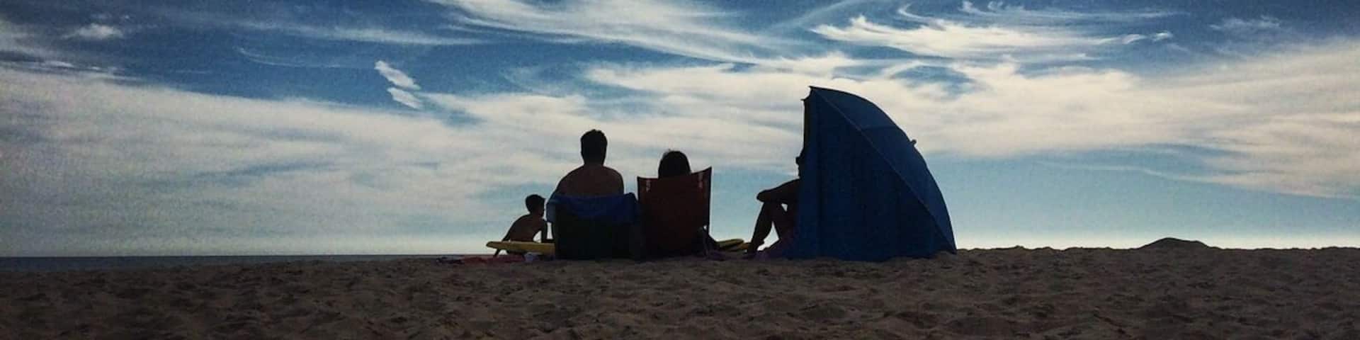 Aside from the crowd factor and regarding the value-for-distance criteria, in in my opinion Costa de Caparica has the best beaches around Lisbon. And there is a gigantic strip of sand with 15km of them! My personal favorites are Praia da Mata and Praia da Morena. The further south you head, the more likely you are to find less crowded beaches and better beach bars.
More on: http://www.geekyexplorer.com/insider-guide-of-beaches-around-lisbon/