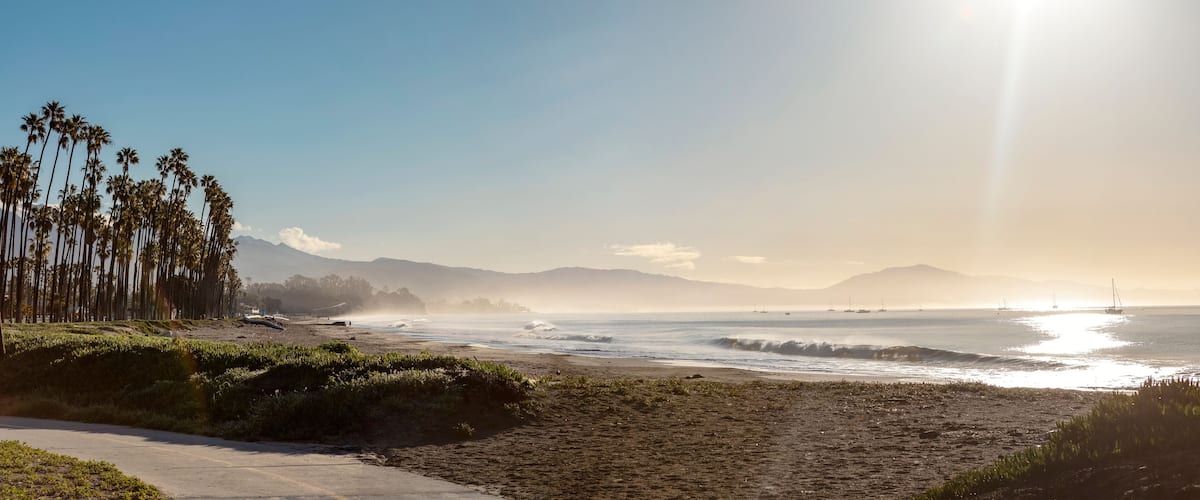 Beautiful morning scenery, with sunshine and reflections, palm trees, morning mist, on the Santa Barbara waterfront in California, USA