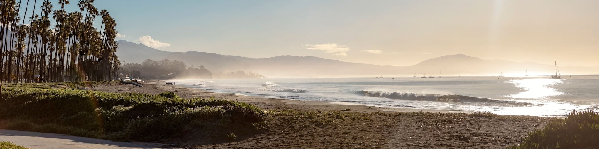 Beautiful morning scenery, with sunshine and reflections, palm trees, morning mist, on the Santa Barbara waterfront in California, USA