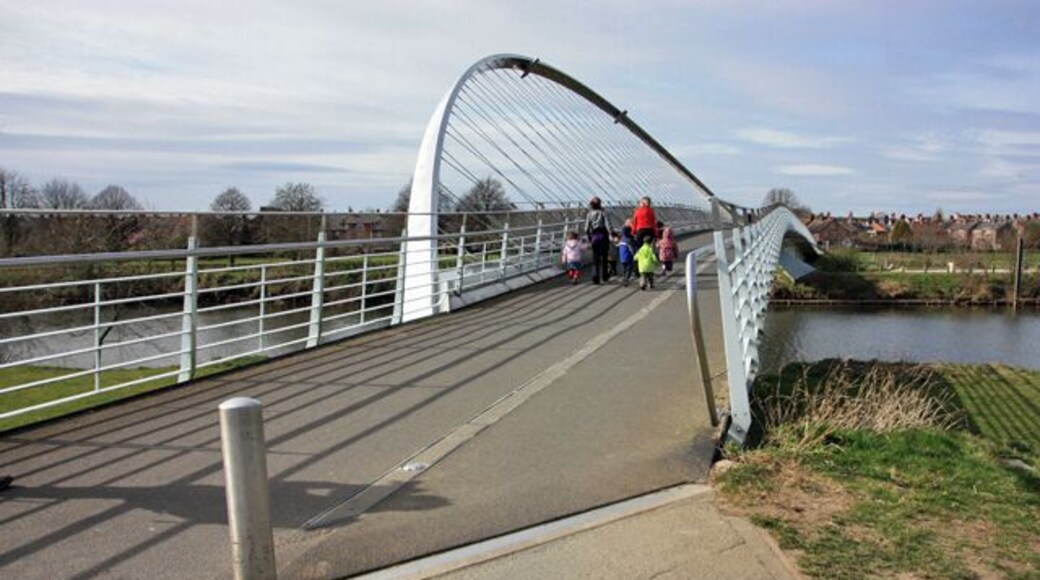 The Millennium bridge over the river Ouse This is a westward view including pedestrians.