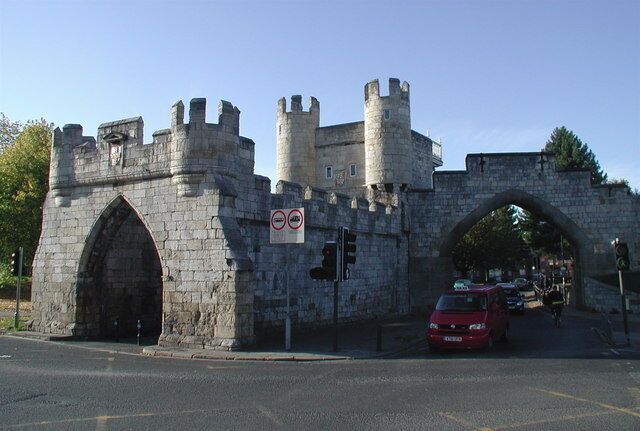 Walmgate Bar, York Looking west from Jenny's Fish & Chips on the corner of Lawrence Street. The gate or 'bar' in York's city walls still has its original 12th century archway with portcullis and 15th century wooden gates (the archway on the right of the picture is more modern). The 14th century barbican protruding from the front would once have spanned a water-filled ditch and worked by trapping attackers in deadly crossfire between two sets of gates. Walmgate Bar was leased out as a house from 1376 right up until 1957.