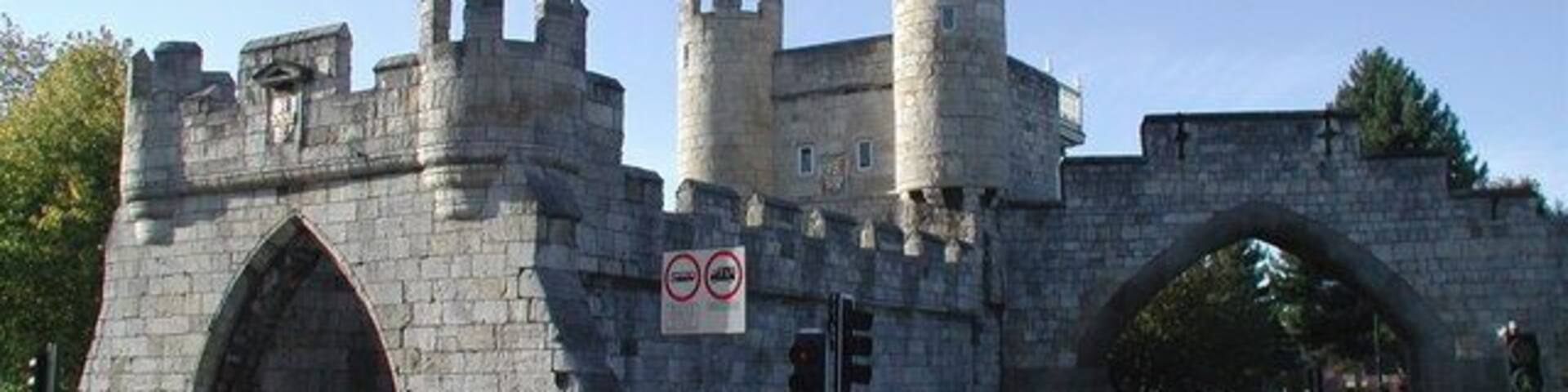 Walmgate Bar, York Looking west from Jenny's Fish & Chips on the corner of Lawrence Street. The gate or 'bar' in York's city walls still has its original 12th century archway with portcullis and 15th century wooden gates (the archway on the right of the picture is more modern). The 14th century barbican protruding from the front would once have spanned a water-filled ditch and worked by trapping attackers in deadly crossfire between two sets of gates. Walmgate Bar was leased out as a house from 1376 right up until 1957.