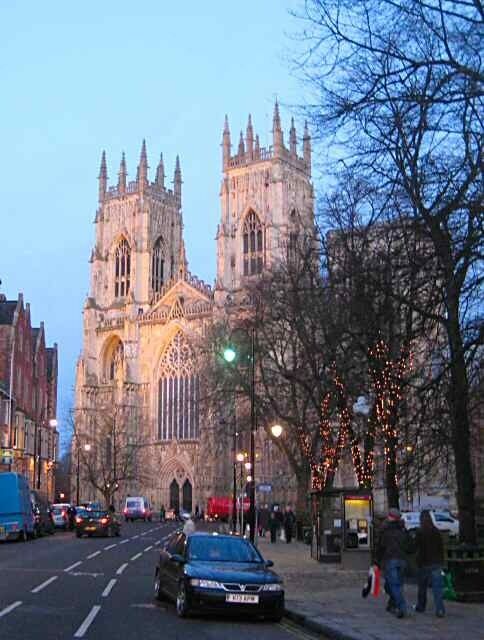 A historic cathedral with twin towers and Gothic architecture.
