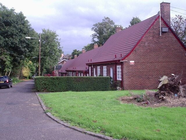 Crosshill Avenue On the original site of Crosshill House with links back to Medieval times this sheltered housing project in Crosshill Avenue is a simple design of a Town-scape (red brick, small-paned casements, red tile roofs etc.) They became category B listed buildings in 1949 forty years after construction. It received a Festival of Britain Award of Merit in 1951.