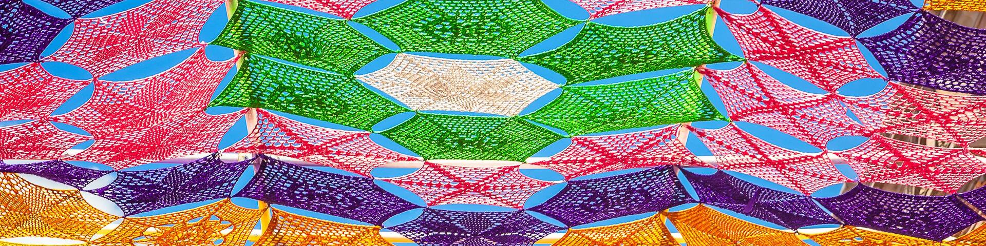 A colorful, intricate canopy structure with a geometric pattern.