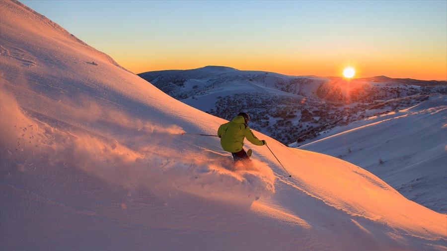 Hotham Heights which includes a sunset, snow and snow skiing