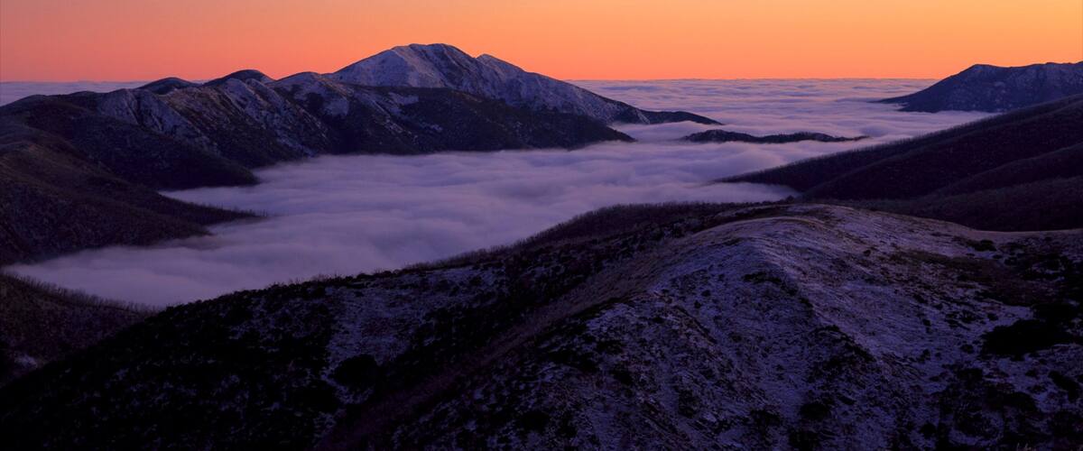 Hotham Heights featuring mountains, snow and a sunset