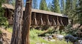 View of Yosemite Wawona covered Bridge over the South Fork Merced River in Mariposa, during the summer, California, USA