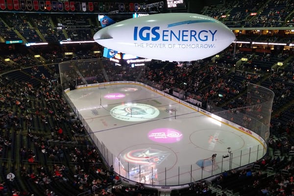 The IGS Energy blimp is a remote control blimp that flies around inside Nationwide Arena during intermissions of Columbus Blue Jackets hockey games. The blimp has a camera that films and projects fans on the giant Dispatch media center that hangs in the center of the arena. The blimp also drops prizes/coupons to eager fans via mini-parachutes.