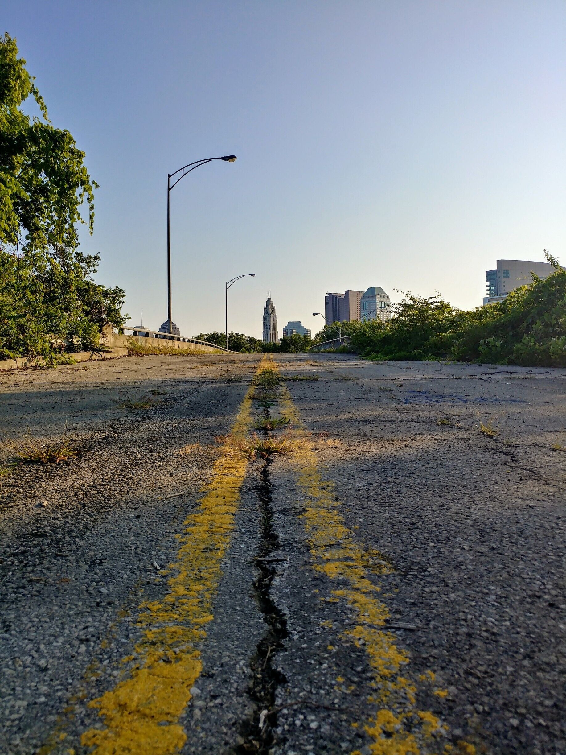 Looking at the Leveque Tower and downtown Columbus from an abandoned highway overpass near Scioto Audubon Metro Park.