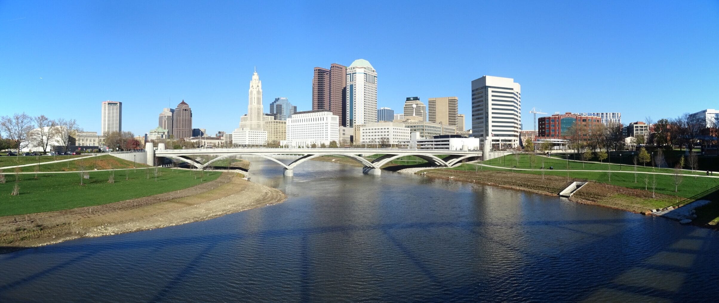 A look upriver from the Main St bridge of the skyline and the newly created parkland along the river downtown.
The Scioto Greenways project consisted of three primary components: 
1) removing the Main Street Dam, 
2) restoring the Scioto River channel, 
3) creating 33 acres of new green space.