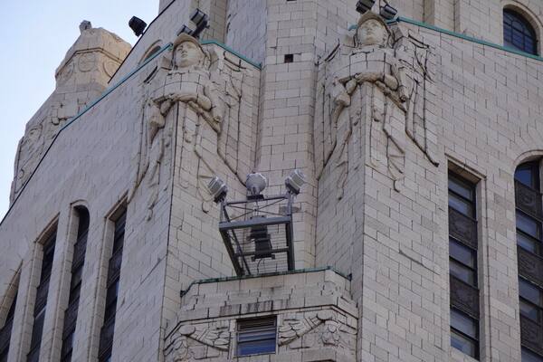 The LeVeque Tower is a steel frame building covered in glazed architectural terra-cotta tiles with an oak-bark texture.
Originally, the building's exterior featured a large number of sculptures. However, much of it had to be removed because the terra-cotta began to crumble and fall to the street. Lost sculptures include four 18 feet eagles at the corners of the building at the 36th floor and four 20 feet statues of colossus and youth on the sides of the building at the setback of the 40th floor
The spaces left by the departed sculpture serve as the bases for lights used to illuminate the tower. The Tower is often illuminated in white, but the colors change for certain holidays. Green for St,. Patrick's Day. Red, White and Blue for the 4th of July. Red and Green for the Christmas season.
#architecture
