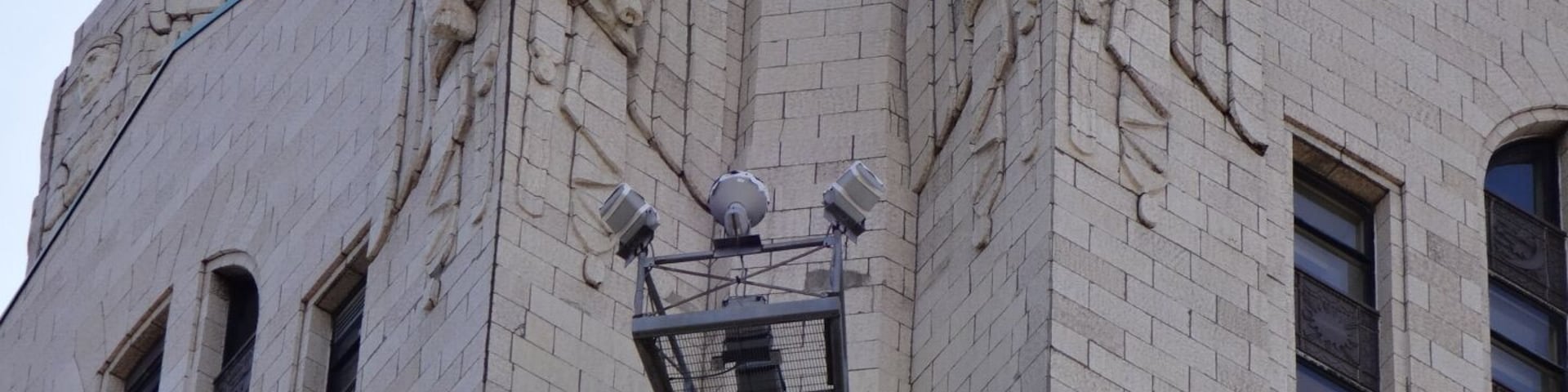 The LeVeque Tower is a steel frame building covered in glazed architectural terra-cotta tiles with an oak-bark texture.
Originally, the building's exterior featured a large number of sculptures. However, much of it had to be removed because the terra-cotta began to crumble and fall to the street. Lost sculptures include four 18 feet eagles at the corners of the building at the 36th floor and four 20 feet statues of colossus and youth on the sides of the building at the setback of the 40th floor 
The spaces left by the departed sculpture serve as the bases for lights used to illuminate the tower. The Tower is often illuminated in white, but the colors change for certain holidays. Green for St,. Patrick's Day. Red, White and Blue for the 4th of July. Red and Green for the Christmas season.
#architecture