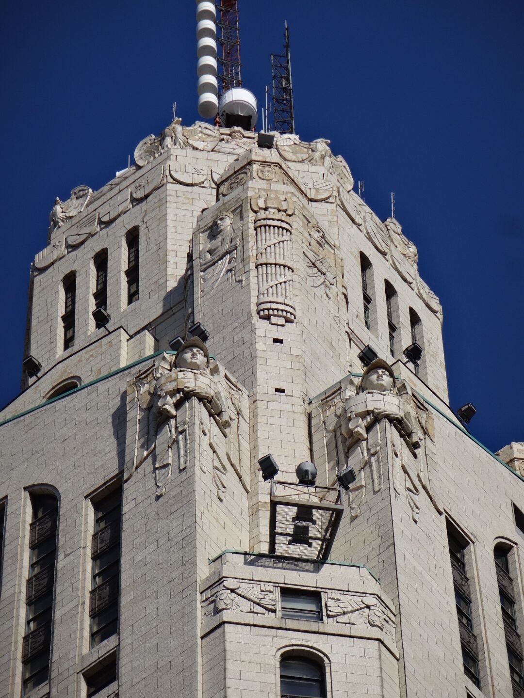 The LeVeque Tower is a steel frame building covered in glazed architectural terra-cotta tiles with an oak-bark texture.

Originally, the building's exterior featured a large number of sculptures. However, much of it had to be removed because the terra-cotta began to crumble and fall to the street. Lost sculptures include four 18 feet eagles at the corners of the building at the 36th floor and four 20 feet statues of colossus and youth on the sides of the building at the setback of the 40th floor 

The spaces left by the departed sculpture serve as the bases for lights used to illuminate the tower. The Tower is often illuminated in white, but the colors change for certain holidays. Green for St,. Patrick's Day. Red, White and Blue for the 4th of July. Red and Green for the Christmas season.

#architecture
