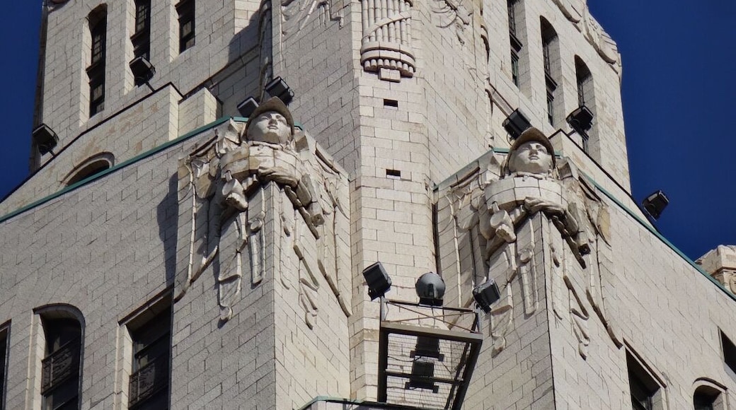 The LeVeque Tower is a steel frame building covered in glazed architectural terra-cotta tiles with an oak-bark texture.
Originally, the building's exterior featured a large number of sculptures. However, much of it had to be removed because the terra-cotta began to crumble and fall to the street. Lost sculptures include four 18 feet eagles at the corners of the building at the 36th floor and four 20 feet statues of colossus and youth on the sides of the building at the setback of the 40th floor
The spaces left by the departed sculpture serve as the bases for lights used to illuminate the tower. The Tower is often illuminated in white, but the colors change for certain holidays. Green for St,. Patrick's Day. Red, White and Blue for the 4th of July. Red and Green for the Christmas season.
#architecture