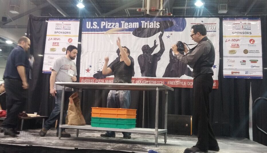 The U.S. Pizza Team Trials at the 2014 North American Pizza and Ice Cream Show. Contestants compete in events such as fastest pizza maker, largest dough stretch and dough acrobatics. The rest of the convention is basically an excuse to gorge yourself on as much free pizza and ice cream samples as you care to consume!