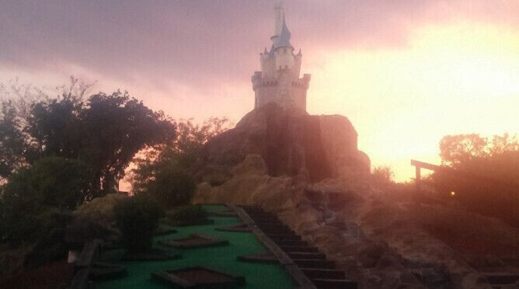 All luck, no skill on this downhill slope with a view of the castle on the mini-golf course at Magic Mountain Family Fun Center.