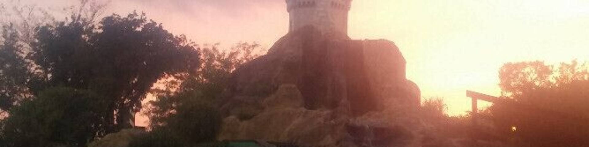 All luck, no skill on this downhill slope with a view of the castle on the mini-golf course at Magic Mountain Family Fun Center.