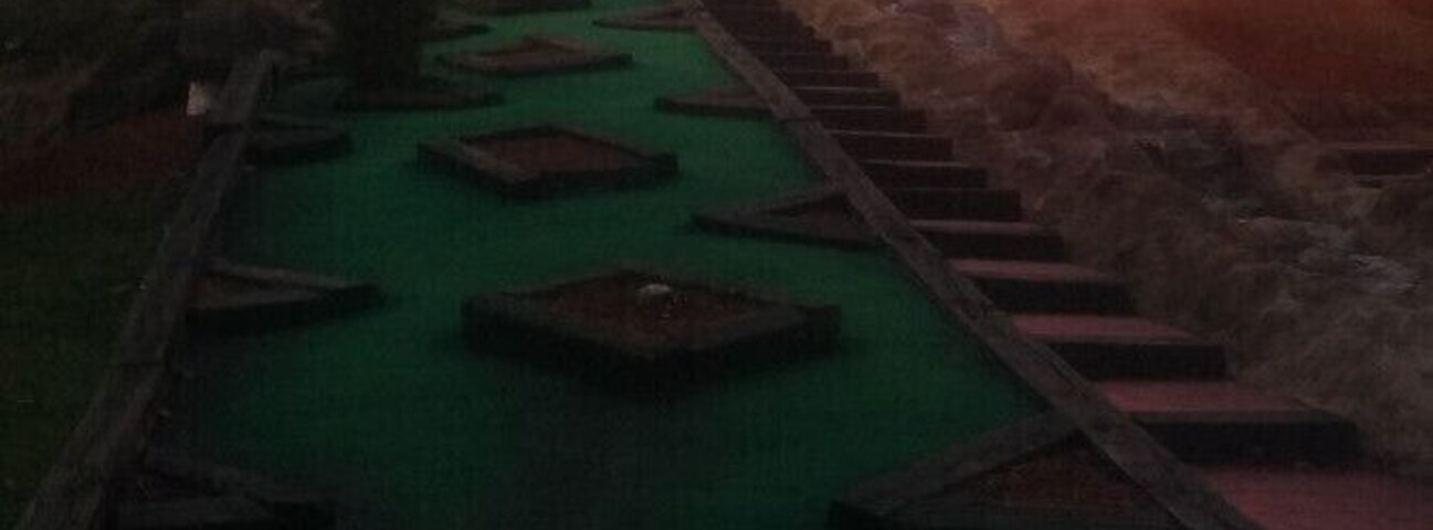All luck, no skill on this downhill slope with a view of the castle on the mini-golf course at Magic Mountain Family Fun Center.
