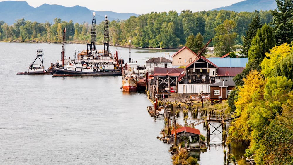 USA, Washington State. Lower Columbia River, Cathlamet Harbor, houseboats, fishing boats and homes.