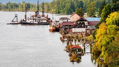 USA, Washington State. Lower Columbia River, Cathlamet Harbor, houseboats, fishing boats and homes.