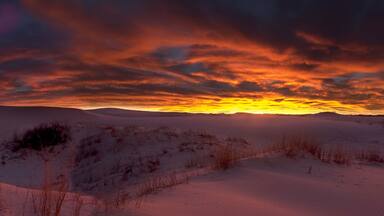 Sunrise over sand dunes